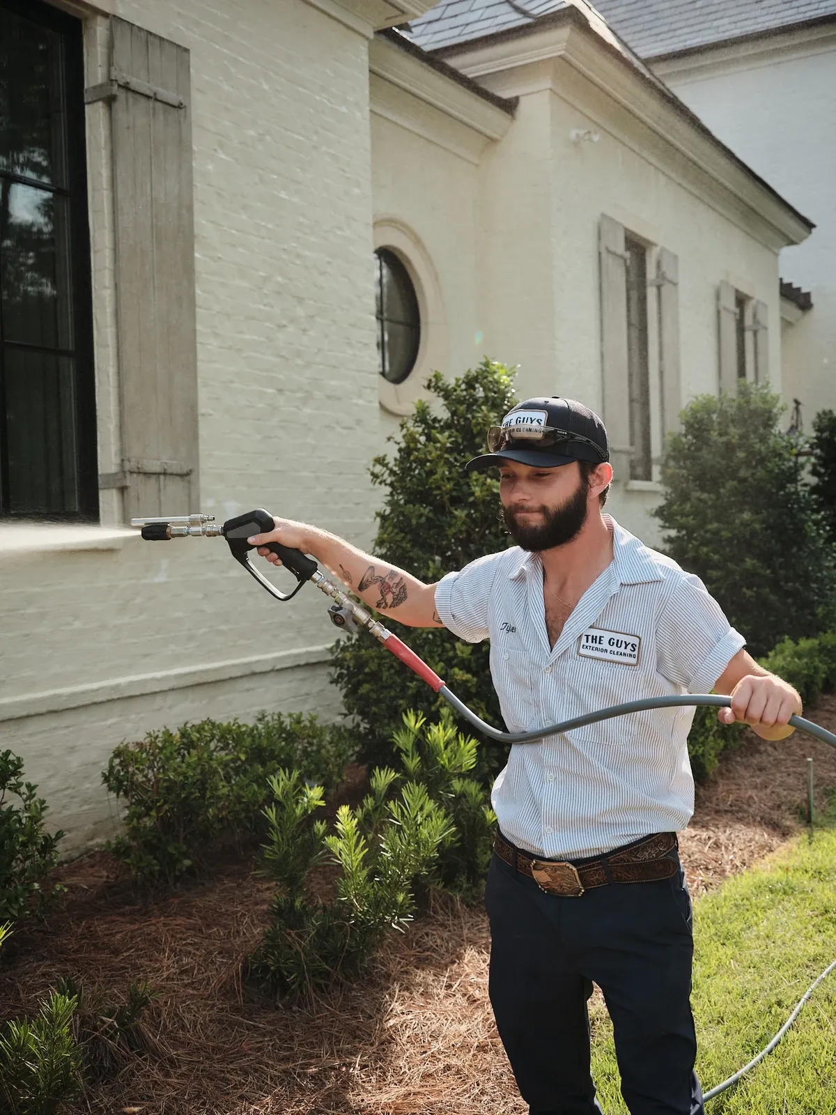 House washing — professional cleaning the exterior of a home
